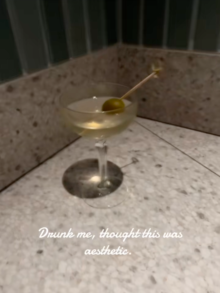photo of a martini glass with the caption: drunk me thought this was so aesthetic