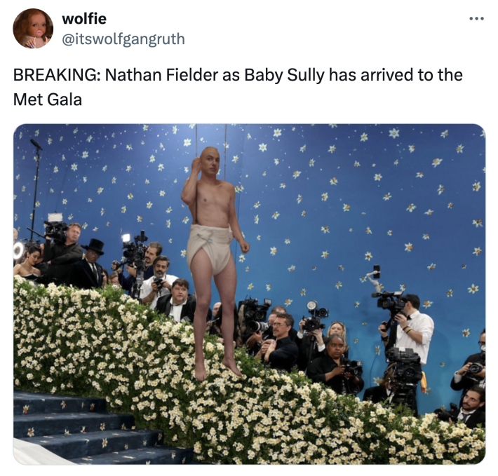 Tweet that says, "BREAKING: Nathan Fielder as Baby Sully has arrived to the Met Gala" with an image of Fielder photoshopped onto the Met Gala stairs.