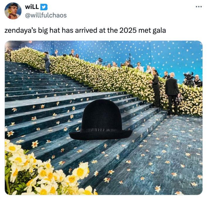 Tweet that says, "zendaya’s big hat has arrived at the 2025 met gala" with an image of her black hat photoshopped onto the Met Gala stairs.