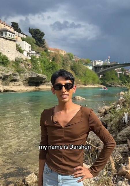 "My name is Darshen" TikTok video in front of a river.