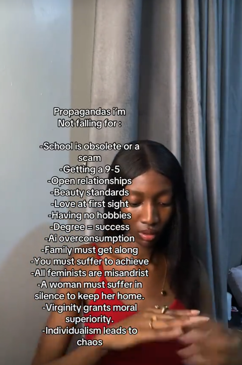 Propaganda I'm not falling for TikTok video with a woman in a red top looking at her hands.