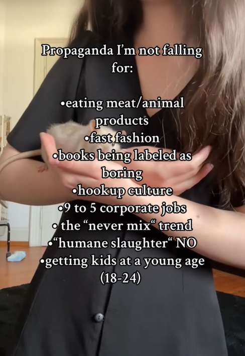 TikTok video with a woman holding a pet rat.