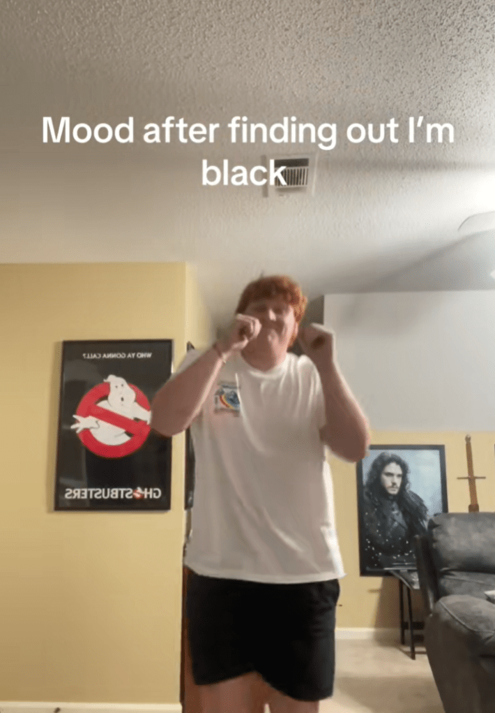 Ginger man dancing in his apartment with text overlay, "Mood after finding out I'm black."