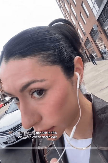 TikTok video about claw clips causing hair loss.