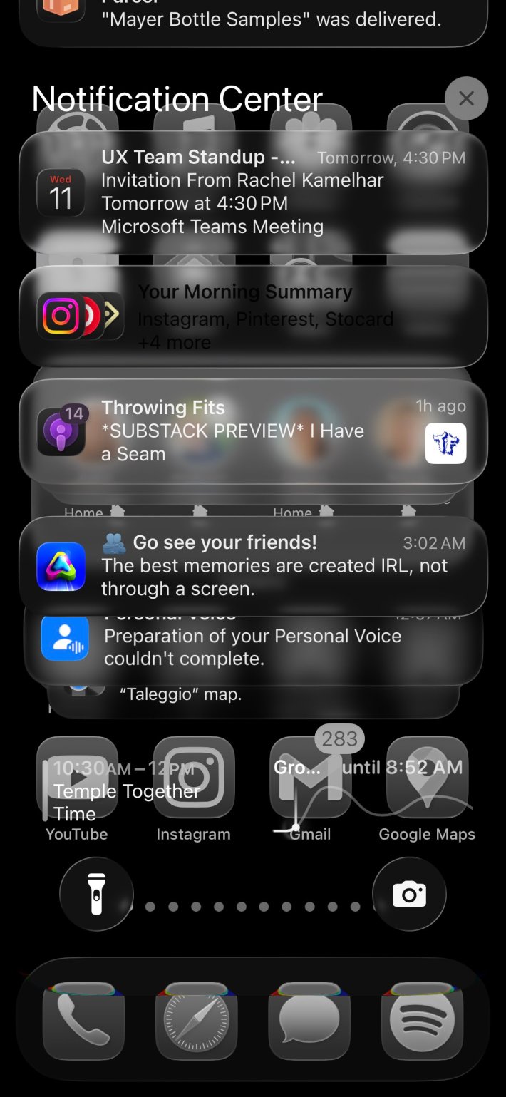 Screenshot of an iPhone's Notification Center with Liquid Glass.