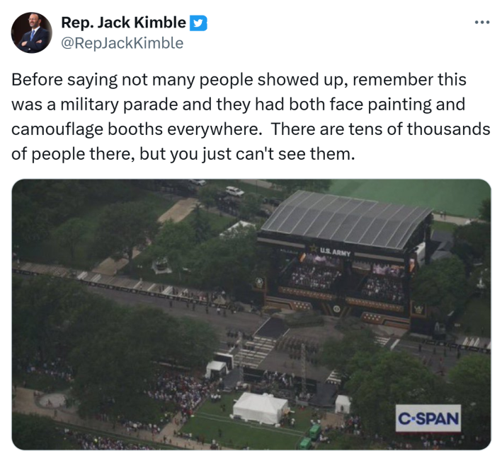 Tweet that reads, "Before saying not many people showed up, remember this was a military parade and they had both face painting and camouflage booths everywhere.  There are tens of thousands of people there, but you just can't see them." with a photo of a very empty street at the military parade.