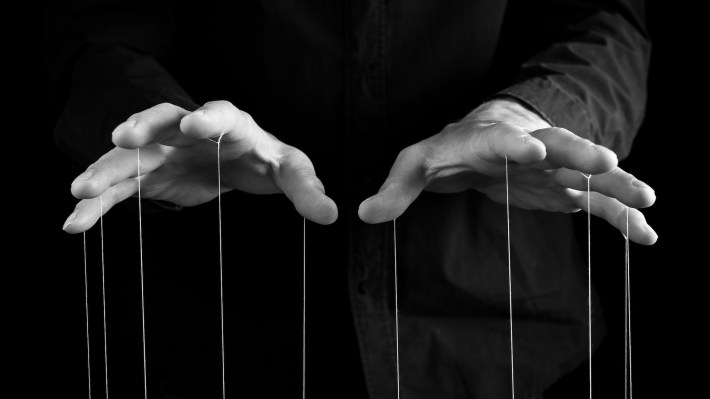 Man hands with strings on fingers.