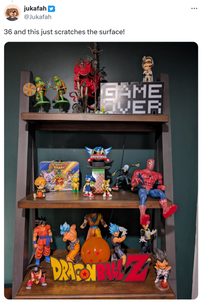 Tweet that reads, "36 and this just scratches the surface!" with a photo of their nerdy shelves filled with toys and figurines.