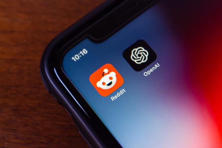 Reddit and OpenAI icons seen in an iPhone. OpenAI and Reddit announced a partnership to enhance ChatGPT with Reddit content and improve Reddit's UX with AI features