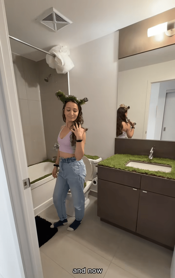 The completed chia seed project, the woman posing in her bathroom complete with chia seed nails and Shrek ears.