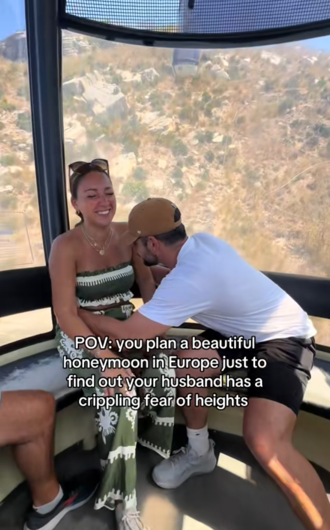 TikTok video showing the couple and the wife's reaction laughing at her husband as he holds onto her.