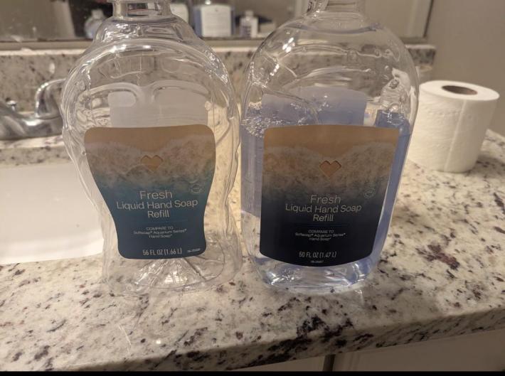 Two refill containers of "fresh liquid hand soap." One looks thinner but contains 56 FL oz while the one next to it contains 50 FL oz.