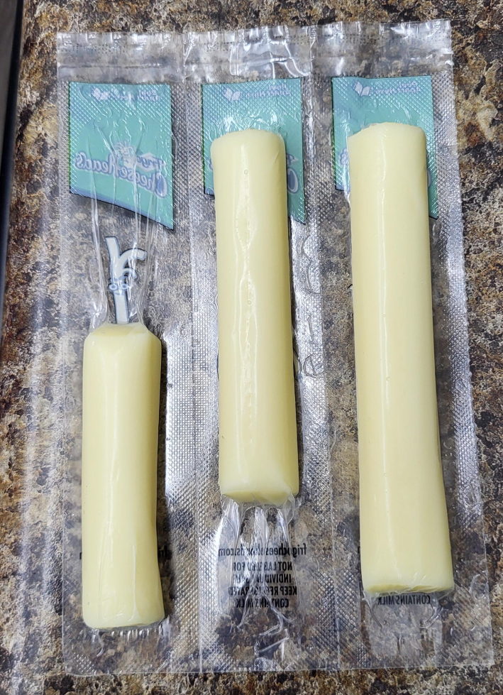 Individual packages of string cheese in wildly different lengths.