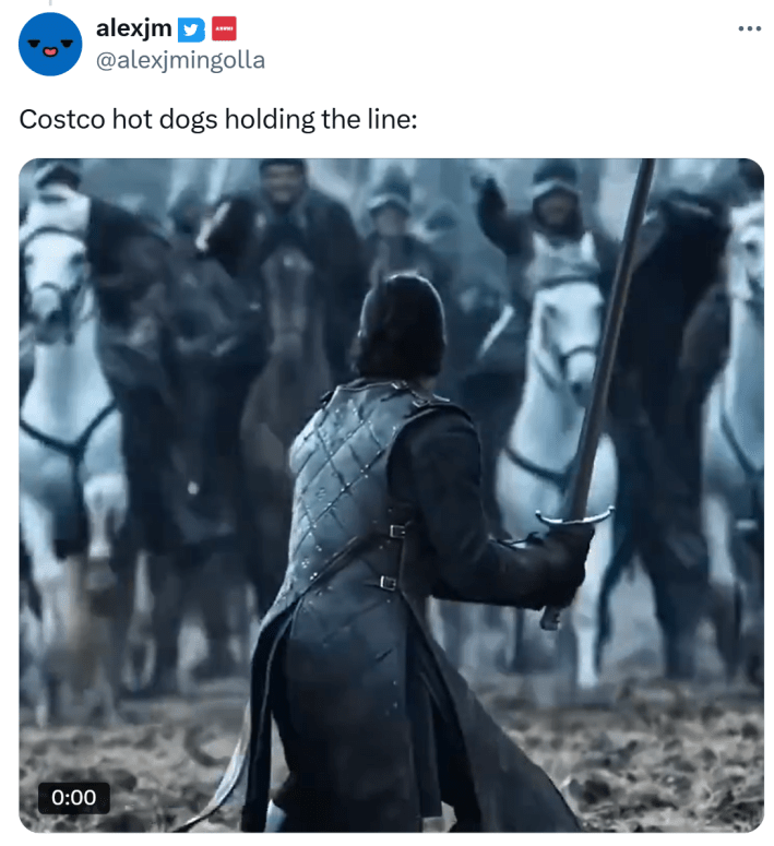 Tweet that reads, "Costco hot dogs holding the line:" with a GIF of Jon Snow against armed and mounted fighters.