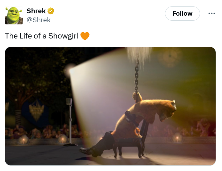 The Life of a Showgirl meme of Puss in Boots singing to a crowd, spotlit.