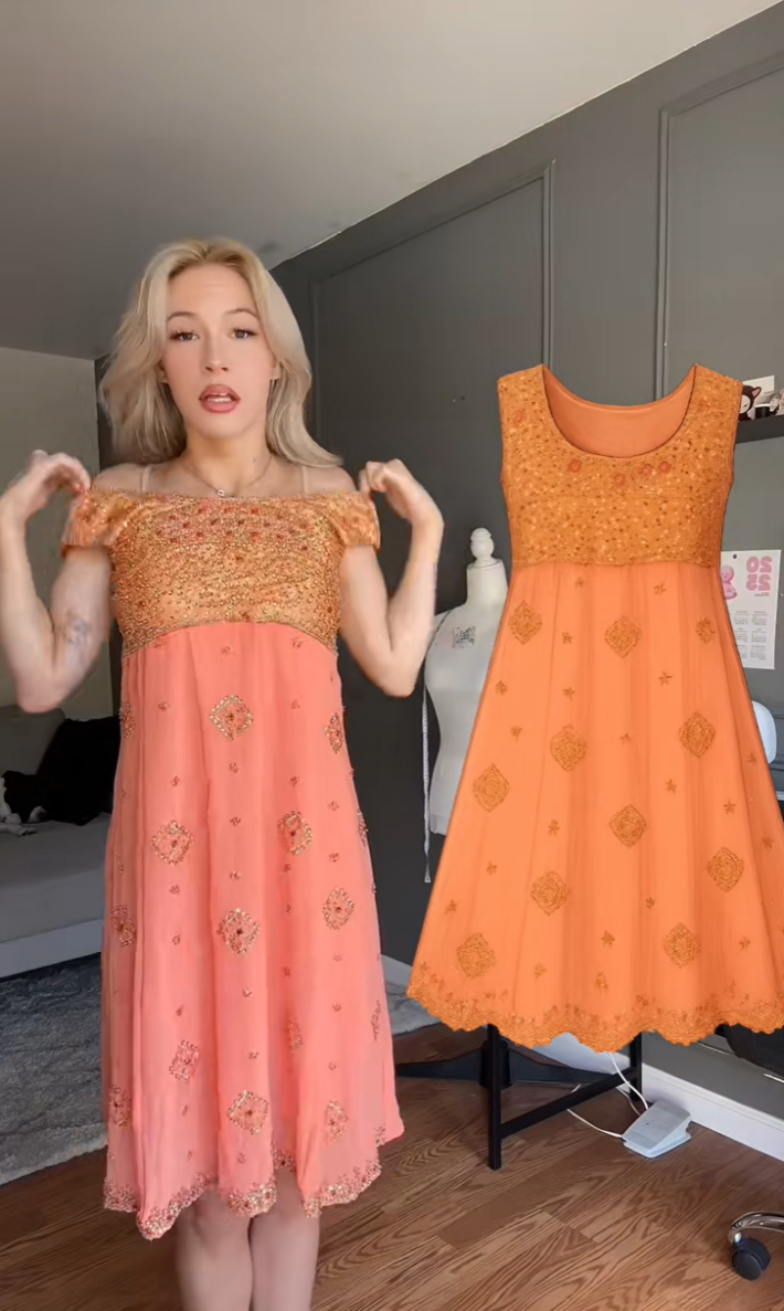 A woman showing off how she edited a thrifted dress.
