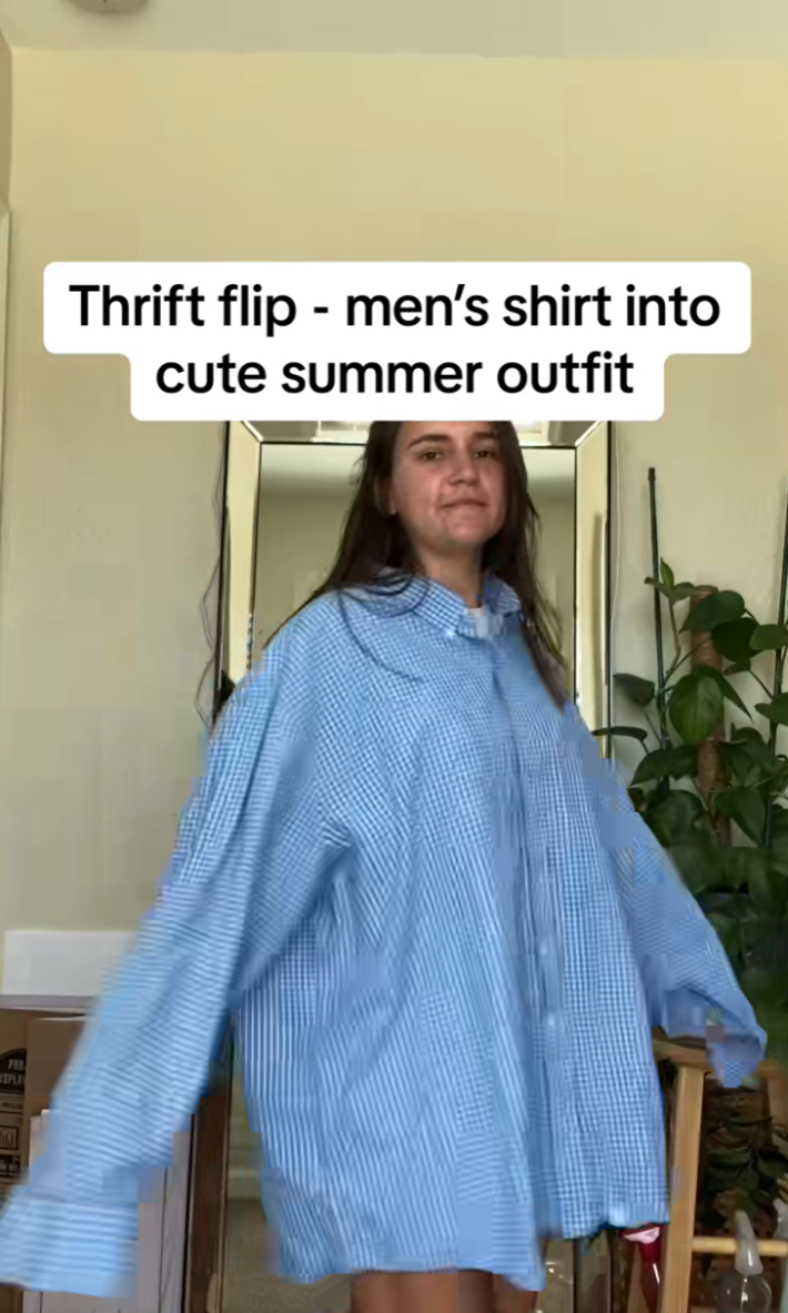 Woman in an oversized men's button-up shirt.