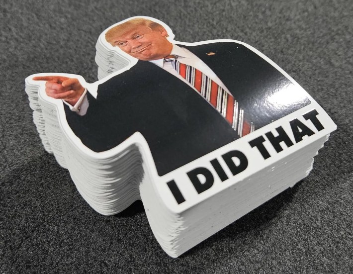 a pile of stickers with donald trump pointing on them with the words, "i did that"