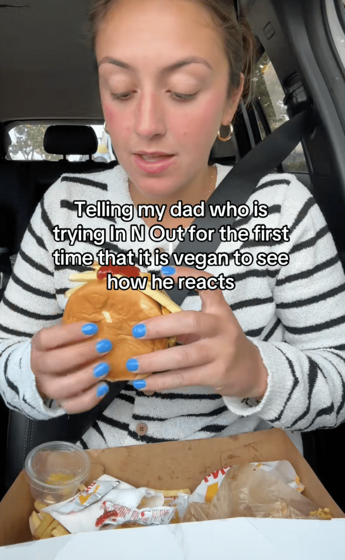 TikTok creator Maddie Goetz recorded her dad’s reaction to his first In N Out burger in a post captioned, "Telling my dad who is tryin In N Out for the first time that it is vegan to see how he reacts."