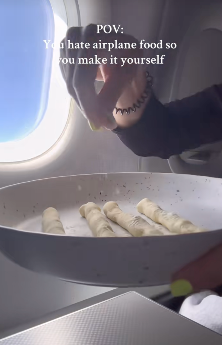 @buonapastaclub/TikTok "POV: You hate airplane food so you make it yourself." chef making pasta mid-flight on an airplane.