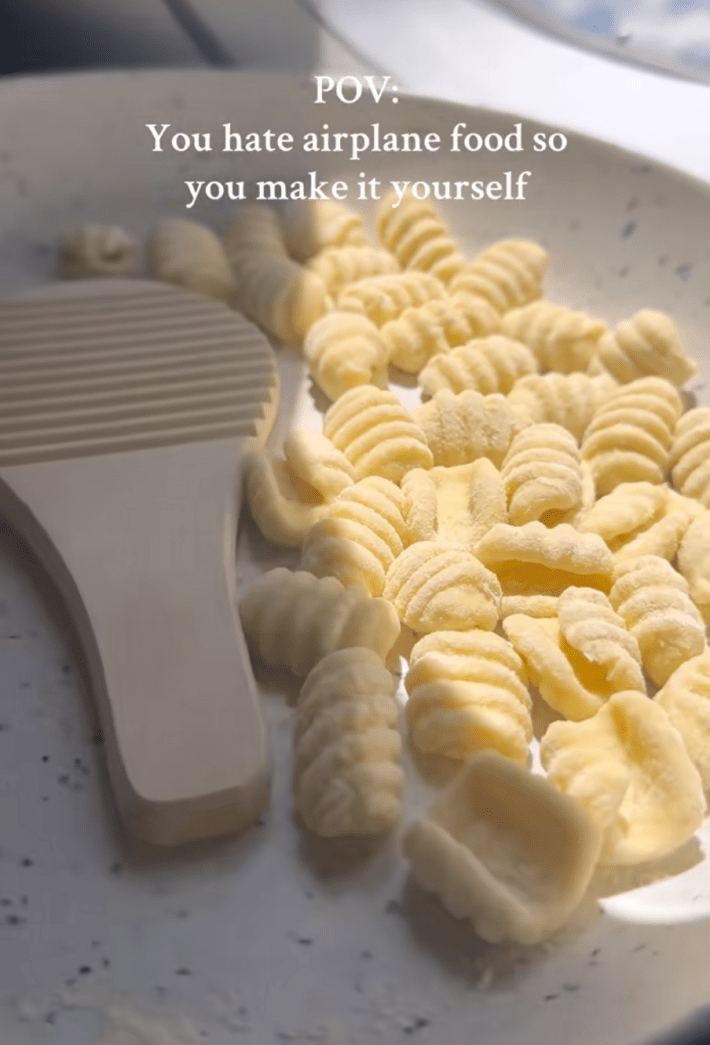 @buonapastaclub/TikTok "POV: You hate airplane food so you make it yourself." chef making pasta mid-flight on an airplane.