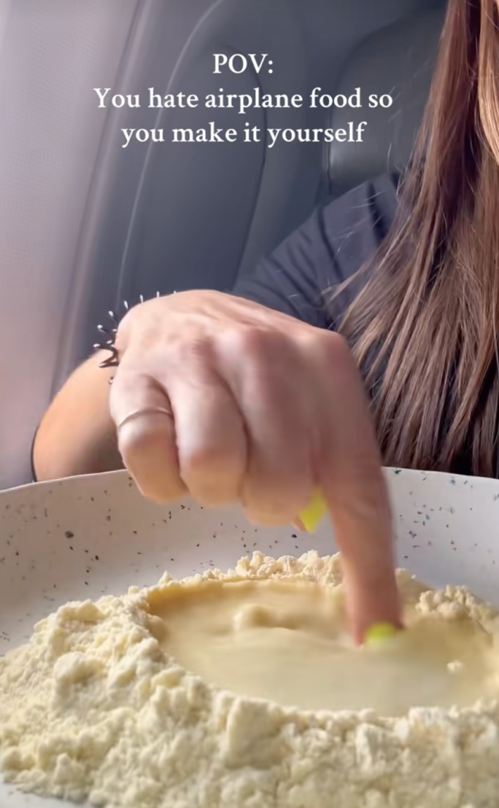 @buonapastaclub/TikTok "POV: You hate airplane food so you make it yourself." chef making pasta mid-flight on an airplane.