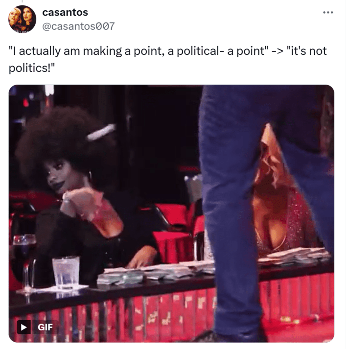 Tweet that reads, "'I actually am making a point, a political- a point' -> 'it's not politics!'" and a GIF of women throwing singles at a man on stage.