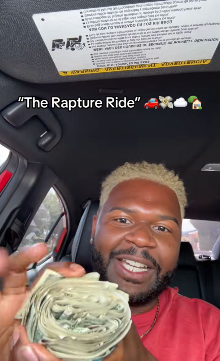 An Uber driver showing the rolled up wad of cash a Christian couple gave him because they think they're leaving in the Rapture on Tuesday.