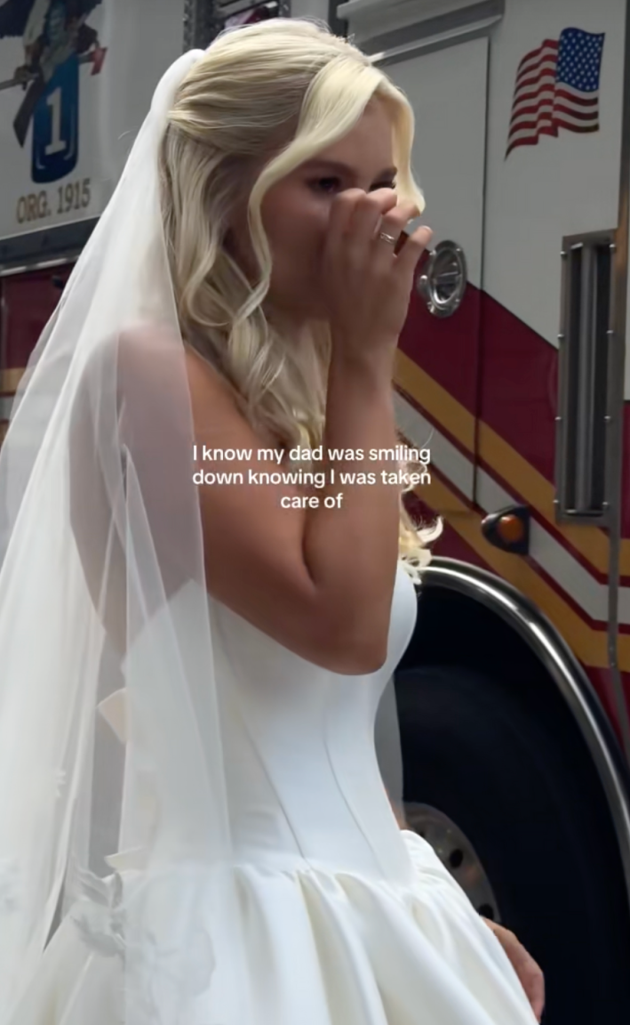 @kristin_schnacky/TikTok - bride crying in front of a fire truck with text "I know my dad was smiling down knowing I was taken care of."
