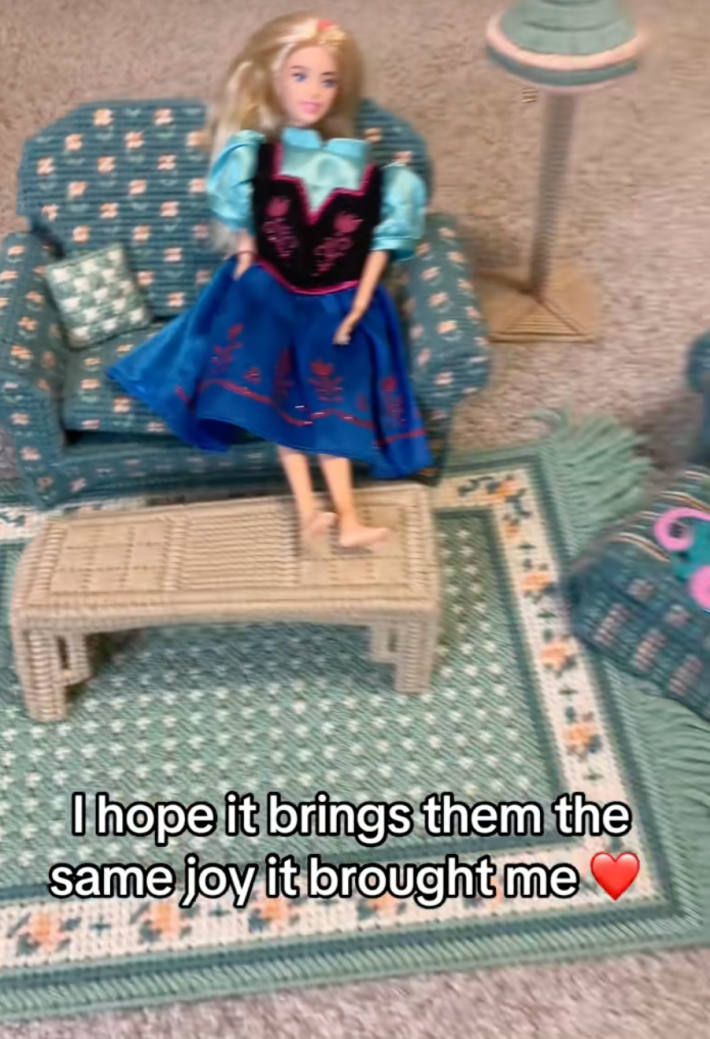 @jenelmore/TikTok, "I hope it brings them the same joy it brought me" barbie sitting on doll furniture couch