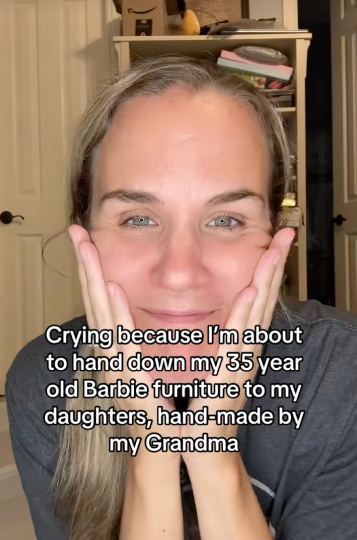 “Crying because I’m about to hand down my 35 year old Barbie furniture to my daughters, hand-made by my grandma,” @jenelmore/TikTok woman with nostalgic expression