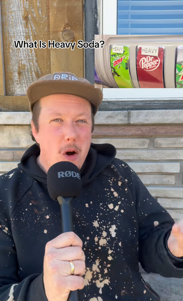 A man with a mic explaining what heavy soda is.