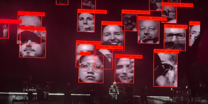 massive attack playing in front of the faces of its crowd