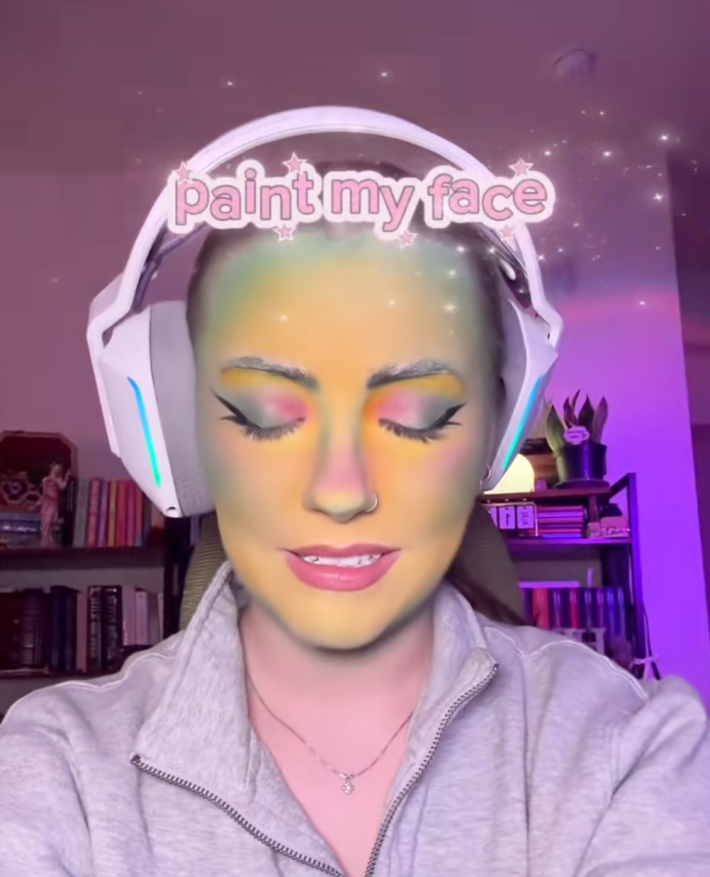 tiktoker with green makeup on face