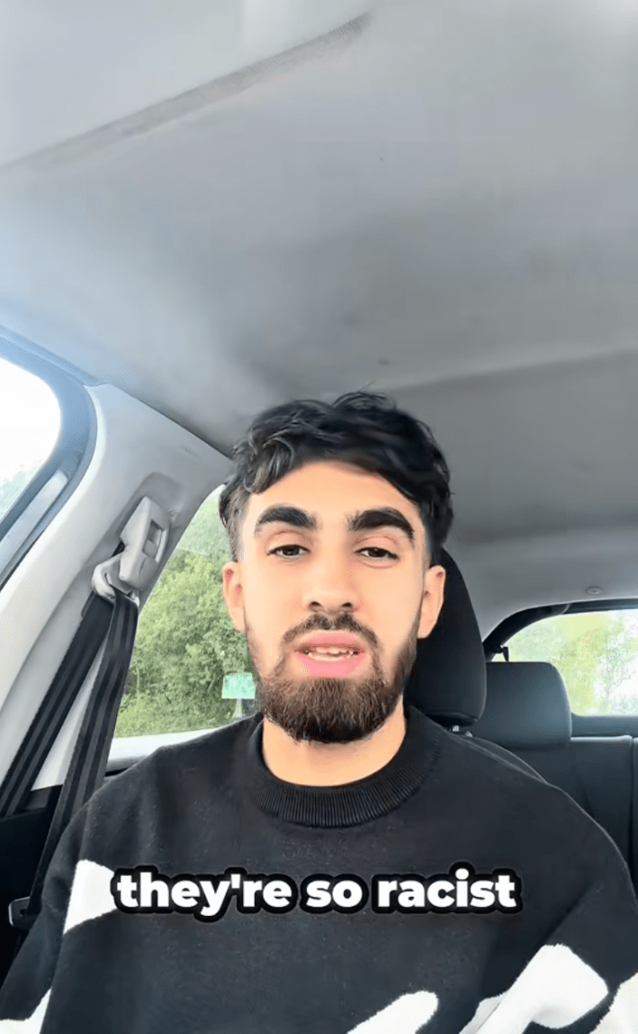 The man stares the camera down while claiming his managers were racist.