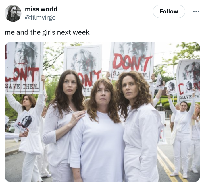 Tweet that reads, "me and the girls next week" with a photo from a show of women in white staring upward, others in the background are holding signs that say, "DON'T save them."