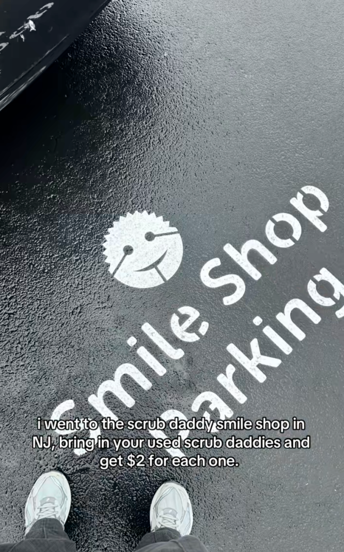 smile shop parking sign in scrub daddy hq parking lot -“I went to the Scrub Daddy Smile Shop in NJ, bring in your used Scrub Daddies and get $2 for each one.”