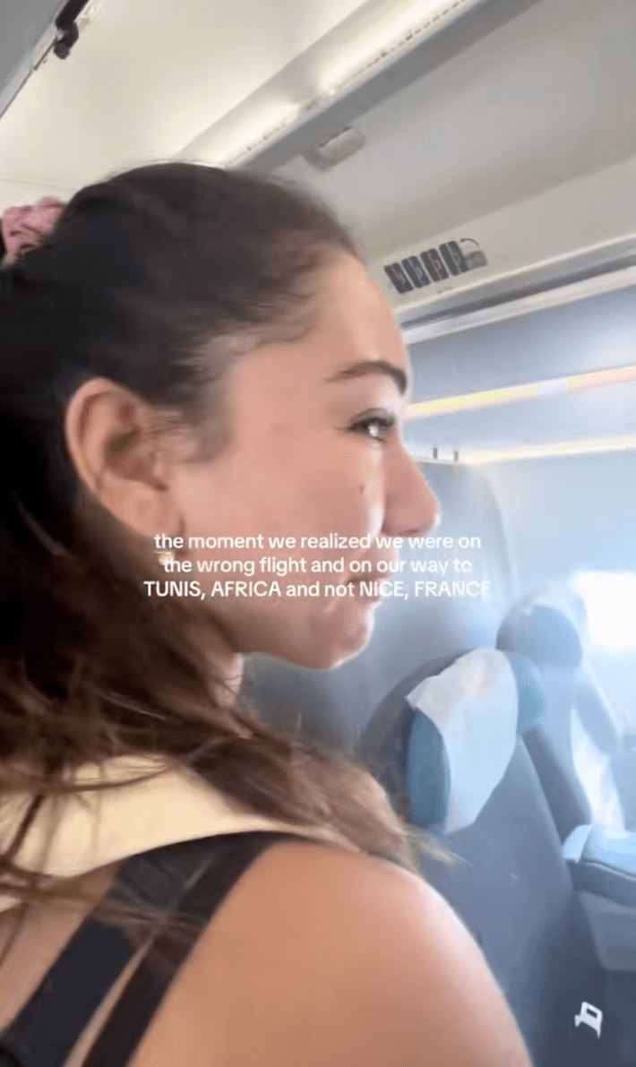 woman looking upset with the words "the moment we realized we were on the wrong flight"
