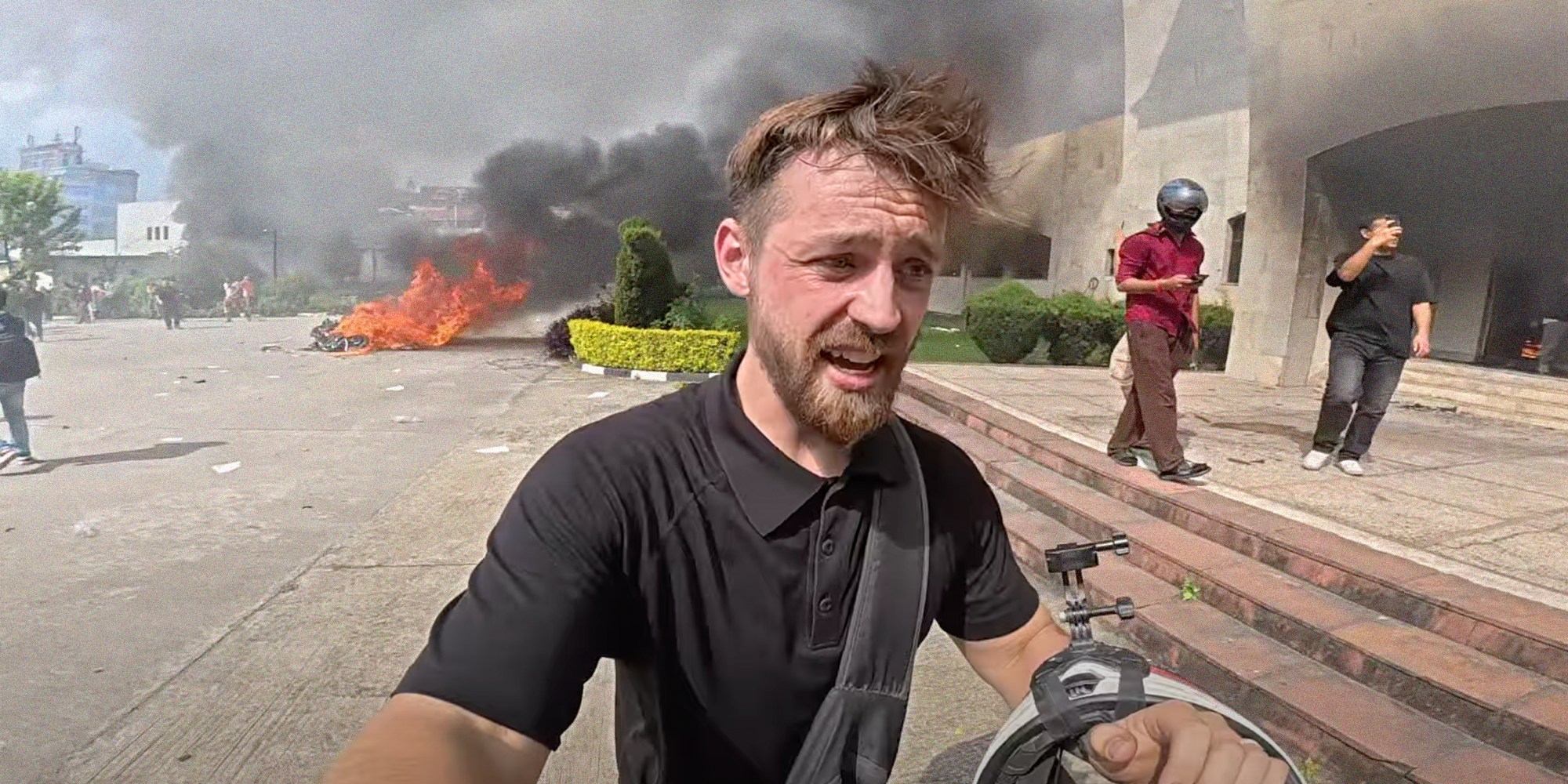 british youtuber running around nepal while things burn in the background