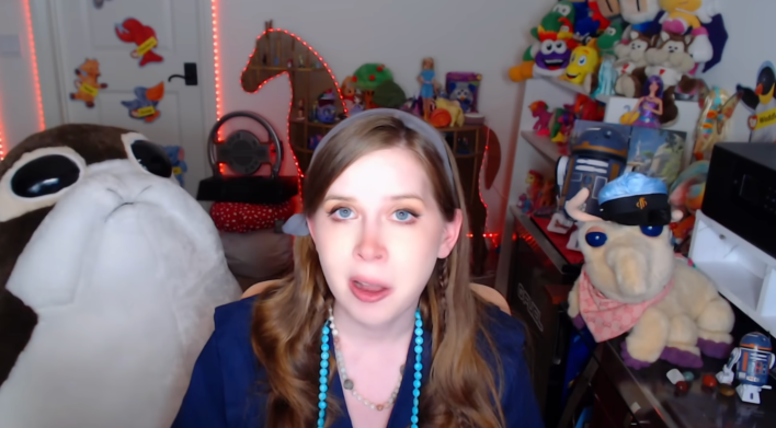 Jenny Nicholson surrounded by stuffed animals