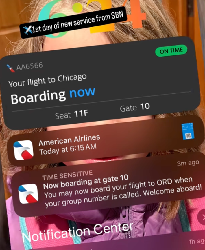 @kristamoats/TikTok "1st day of new service from SBN" phone lock screen showing boarding gate information for American Airlines flight
