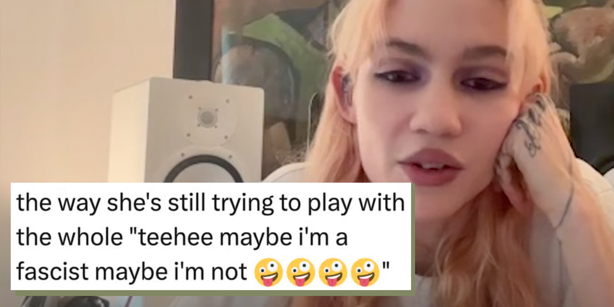 Musician Grimes looking into the camera. Text overlay reads, the way she's still trying to play with the whole "teehee maybe i'm a fascist maybe i'm not."