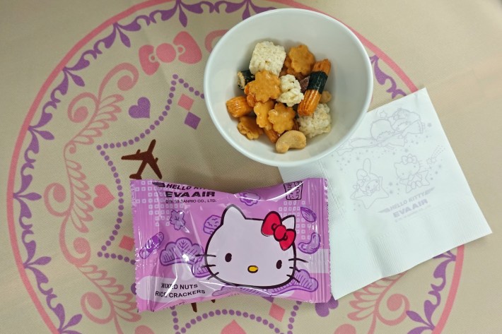 Inside an airplane from Taiwanese airline Eva Air (BR) decorated with a Hello Kitty theme, from the seats to in-flight toilet paper.