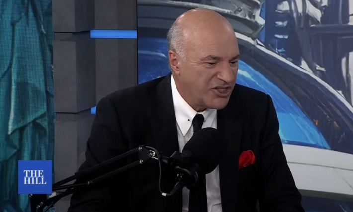 kevin o'leary speaking to a microphone