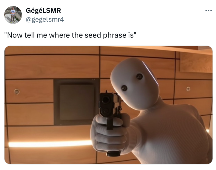 Tweet that reads, "Now tell me where the seed phrase is" with the robot holding a gun at the camera.