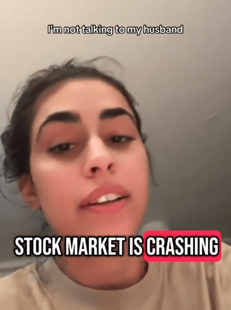 TikTok video of a woman saying "stock market is crashing" to the camera with a caption reading "I'm not talking to my husband."