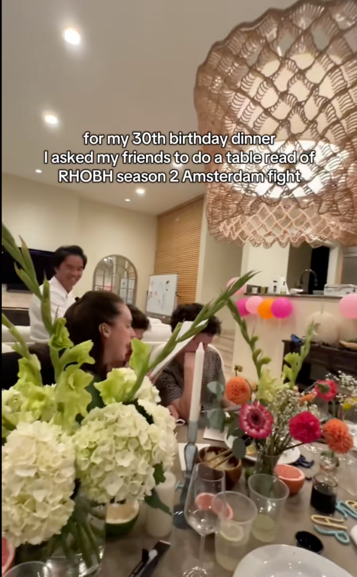 Reenactment of the dinner scene, with a woman faux-screaming lines while the amused server looks on in the background.