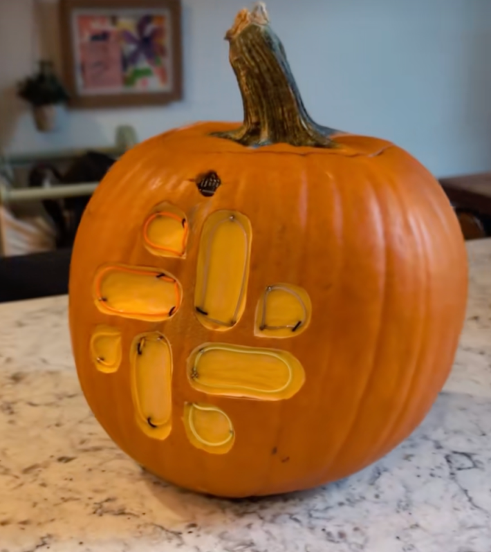 @guy_dupont/TikTok pumpkin carved with slack logo