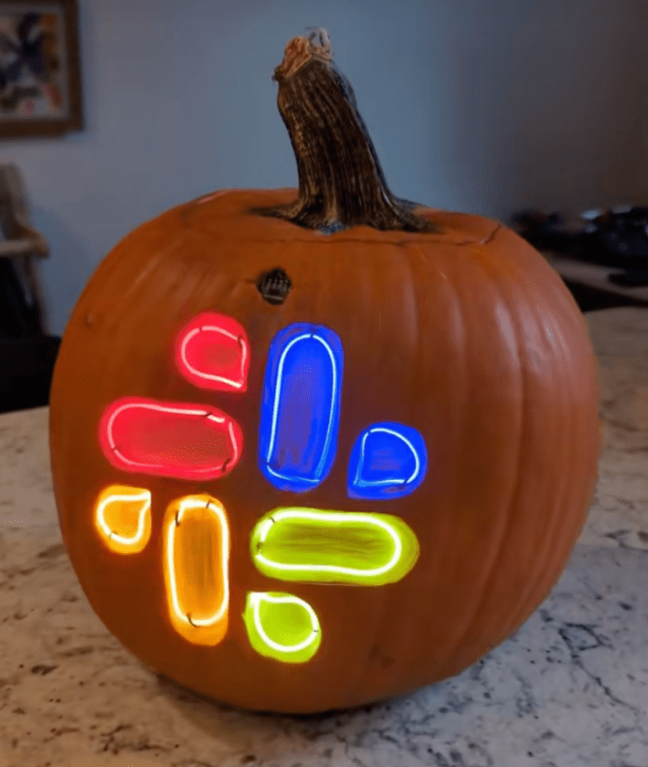 @guy_dupont/TikTok Dupont showing pumpkin carved with slack logo lit up