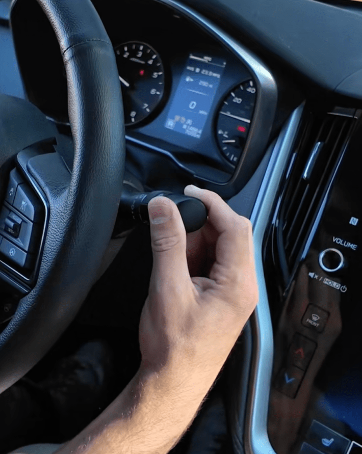 @youngsubaruogden/TikTok demonstrating backup cam cleaner feature in newer subaru models - turning a knob next to the steering wheel.